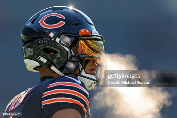 Justin Fields of the Chicago Bears looks on during warm ups prior to the game against the Philadelphia Eagles at Soldier Field on December 18, 2022...