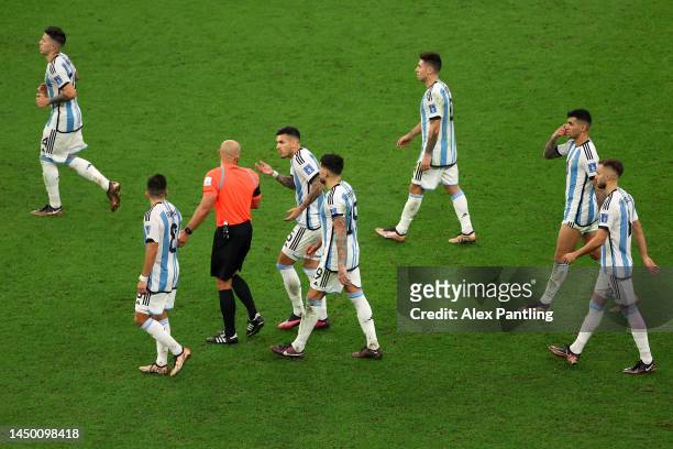Argentina players protest to Referee Szymon Marciniak during the FIFA World Cup Qatar 2022 Final match between Argentina and France at Lusail Stadium...