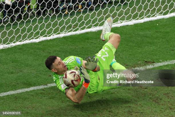 Emiliano Martinez of Argentina saves the second penalty by Kingsley Coman of France in the penalty shootout during the FIFA World Cup Qatar 2022...