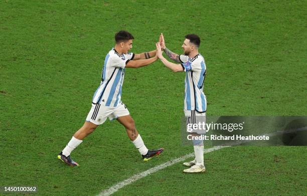 Paulo Dybala of Argentina celebrates with Lionel Messi scoring the team's second penalty in the penalty shoot out during the FIFA World Cup Qatar...