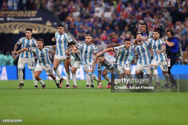 Argentina players celebrate the fourth and winning penalty by Gonzalo Montiel in the penalty shootout during the FIFA World Cup Qatar 2022 Final...