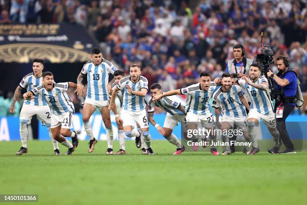 Argentina players celebrate the fourth and winning penalty by Gonzalo Montiel in the penalty shootout during the FIFA World Cup Qatar 2022 Final...