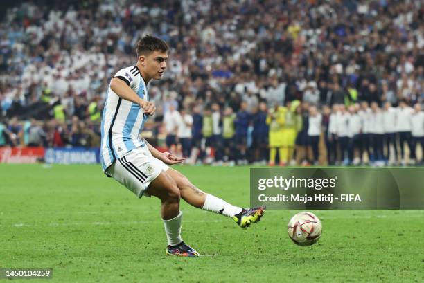 Paulo Dybala of Argentina scores the team's second penalty in the penalty shoot out during the FIFA World Cup Qatar 2022 Final match between...