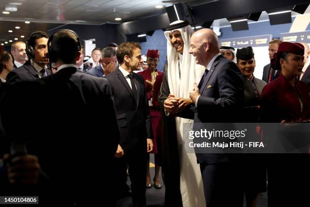 French President Emmanuel Macron looks on with Sheikh Tamim bin Hamad Al Thani, Emir of Qatar, and Gianni Infantino, President of FIFA, in the tunnel...