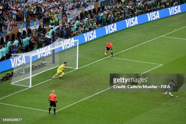 Gonzalo Montiel of Argentina scores their penalty during the penalty shootout as Hugo Lloris of France attempts to make a save during the FIFA World...