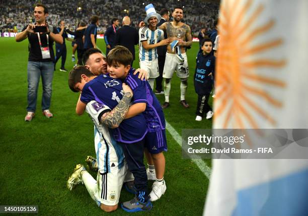 Lionel Messi of Argentina celebrates with family after winning the FIFA World Cup via a penalty shoot out victory during the FIFA World Cup Qatar...