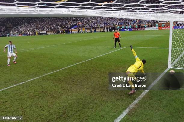 Leandro Paredes of Argentina scores the team's third penalty past Hugo Lloris of France in the penalty shoot out during the FIFA World Cup Qatar 2022...