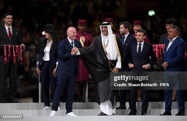 Gianni Infantino, President of FIFA, and Sheikh Tamim bin Hamad Al Thani, Emir of Qatar, shake hands during the award ceremony following the FIFA...