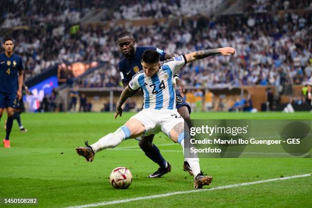 Dayot Upamecano of France battles for possession with Enzo Fernandez of Argentinia during the FIFA World Cup Qatar 2022 Final match between Argentina...