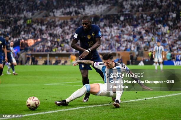 Dayot Upamecano of France battles for possession with Enzo Fernandez of Argentinia during the FIFA World Cup Qatar 2022 Final match between Argentina...