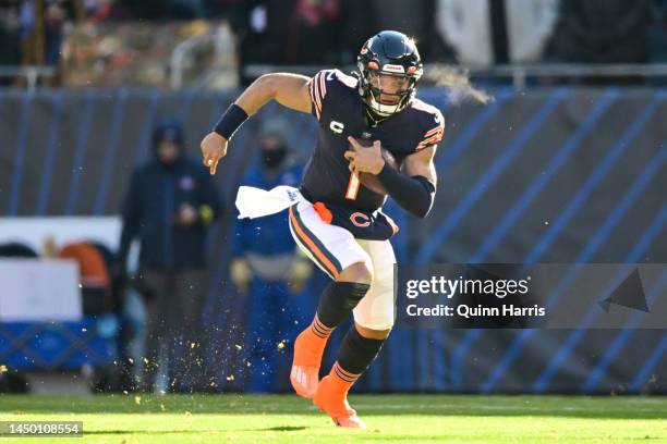 Justin Fields of the Chicago Bears runs with the ball during the first quarter in the game against the Philadelphia Eagles at Soldier Field on...