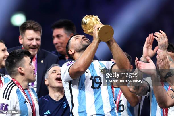 Former Argentina player Sergio Aguero lifts the FIFA World Cup Qatar 2022 Winner's Trophy during the FIFA World Cup Qatar 2022 Final match between...