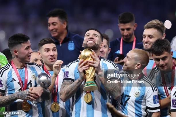 Nicolas Otamendi of Argentina lifts the FIFA World Cup Qatar 2022 Winner's Trophy during the FIFA World Cup Qatar 2022 Final match between Argentina...
