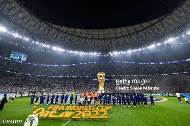 Argentina and France teams line up for the singing of the national anthems ahead of the FIFA World Cup Qatar 2022 Final match between Argentina and...