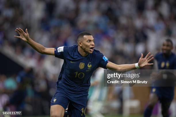 Kylian Mbappe of France celebrates scoring a goal to make it 2-2 during the FIFA World Cup Qatar 2022 Final match between Argentina and France at...