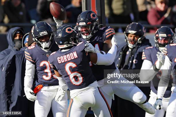 Kyler Gordon and Matthew Adams of the Chicago Bears celebrate after an interception during the first quarter in the game against the Philadelphia...