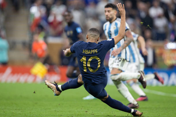 Kylian Mbappe of France scores a goal to make it 2-2 during the FIFA World Cup Qatar 2022 Final match between Argentina and France at Lusail Stadium...