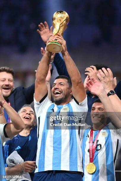 Former Argentina player Sergio Aguero lifts the FIFA World Cup Qatar 2022 Winner's Trophy during the FIFA World Cup Qatar 2022 Final match between...