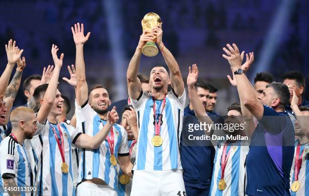 Guido Rodriguez of Argentina lifts the FIFA World Cup Qatar 2022 Winner's Trophy after the FIFA World Cup Qatar 2022 Final match between Argentina...