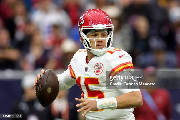 Patrick Mahomes of the Kansas City Chiefs looks to pass against the Houston Texans during the first half of the game at NRG Stadium on December 18,...