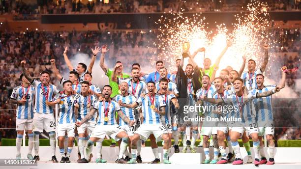 Lionel Messi of Argentina lifts the FIFA World Cup Qatar 2022 Winner's Trophy following the FIFA World Cup Qatar 2022 Final match between Argentina...