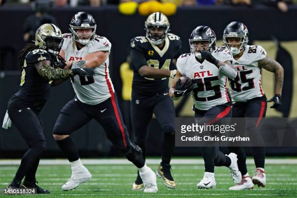 Tyler Allgeier of the Atlanta Falcons runs the ball during the first half in the game against the New Orleans Saints at Caesars Superdome on December...