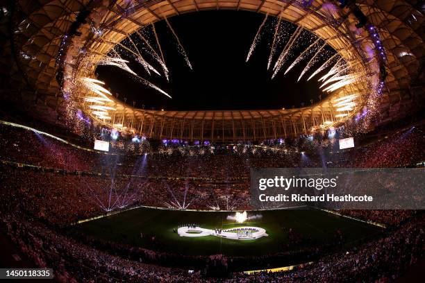 Fireworks explode over the stadium as Lionel Messi of Argentina lifts the FIFA World Cup Qatar 2022 Winner's Trophy during the FIFA World Cup Qatar...