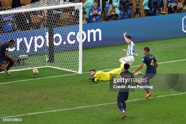 Lionel Messi of Argentina scores the team's third goal past Hugo Lloris of France during the FIFA World Cup Qatar 2022 Final match between Argentina...