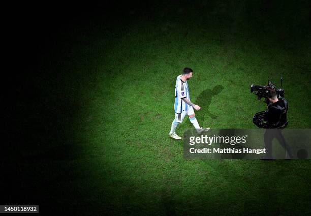 Lionel Messi of Argentina walks to the stage in the trophy presentation after the FIFA World Cup Qatar 2022 Final match between Argentina and France...