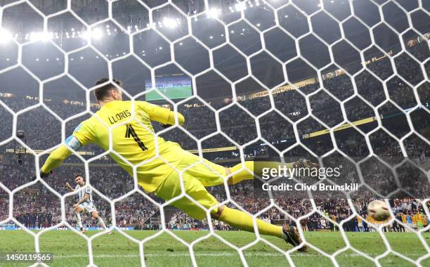 Gonzalo Montiel of Argentina scores the team's fourth and winning penalty past Hugo Lloris of France in the penalty shoot out during the FIFA World...