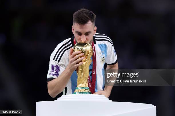 Nicolas Tagliafico of Argentina kisses the FIFA World Cup winning trophy during the award ceremony following the FIFA World Cup Qatar 2022 Final...