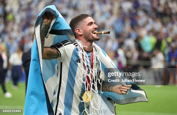 Rodrigo De Paul of Argentina celebrates with a cigar after the win during the FIFA World Cup Qatar 2022 Final match between Argentina and France at...