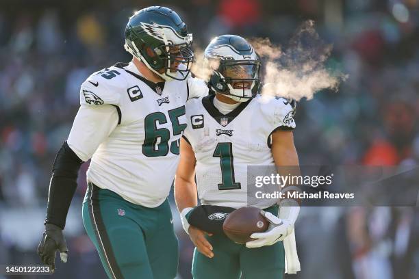 Jalen Hurts of the Philadelphia Eagles celebrates a touchdown during the third quarter with Lane Johnson in the game against the Chicago Bears at...