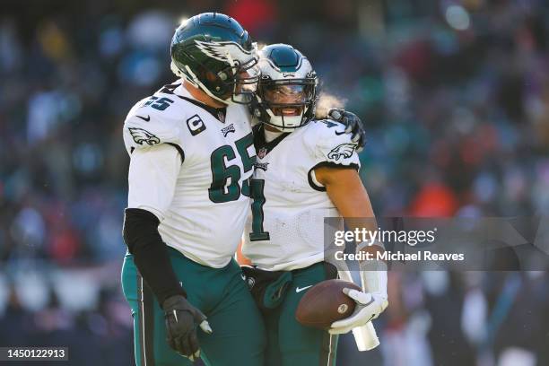 Jalen Hurts of the Philadelphia Eagles celebrates a touchdown during the third quarter with Lane Johnson in the game against the Chicago Bears at...