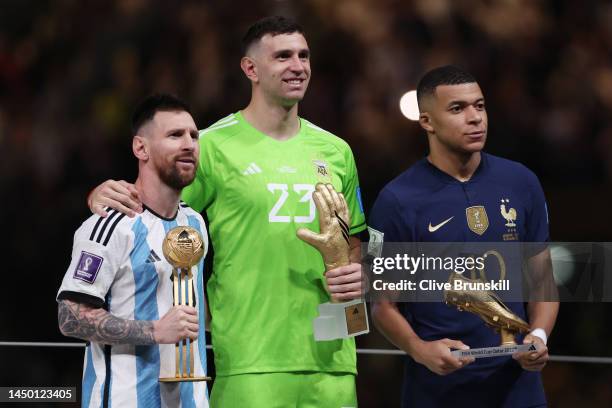 Adidas Golden Ball winner Lionel Messi, adidas Golden Glove winner Emiliano Martinez of Argentina and adidas Golden Boot winner Kylian Mbappe of...