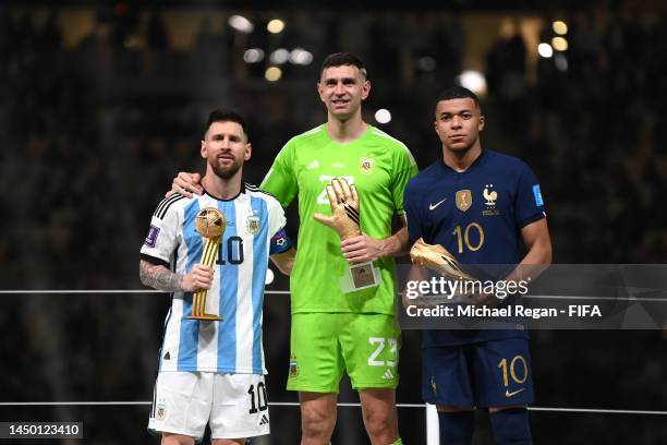 Adidas Golden Ball winner Lionel Messi, adidas Golden Glove winner Emiliano Martinez of Argentina and adidas Golden Boot winner Kylian Mbappe of...