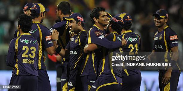 Kolkata Knight Riders cricketers celebrate after winning the IPL Twenty20 first playoff cricket match between Delhi Daredevils and Kolkata Knight...