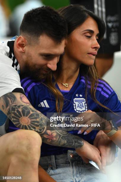 Lionel Messi of Argentina celebrates with his wife Antonela Roccuzzo and the FIFA World Cup Qatar 2022 Winner's Trophy following the FIFA World Cup...