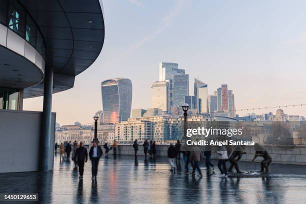 london city workers against high rise office buildings - london cityscape stock pictures, royalty-free photos & images