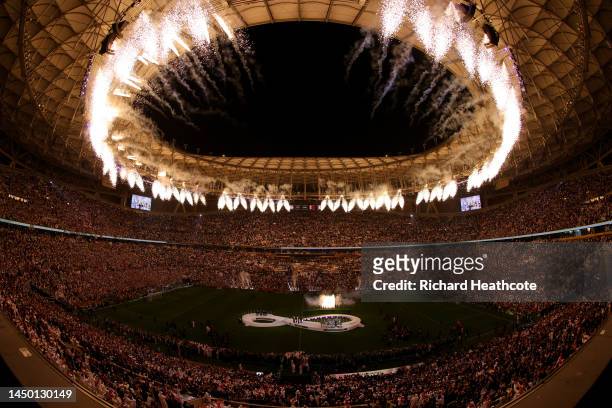 Fireworks explode over the stadium as Lionel Messi of Argentina lifts the FIFA World Cup Qatar 2022 Winner's Trophy during the FIFA World Cup Qatar...