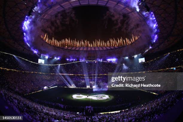 Fireworks explode over the stadium as Lionel Messi of Argentina lifts the FIFA World Cup Qatar 2022 Winner's Trophy during the FIFA World Cup Qatar...