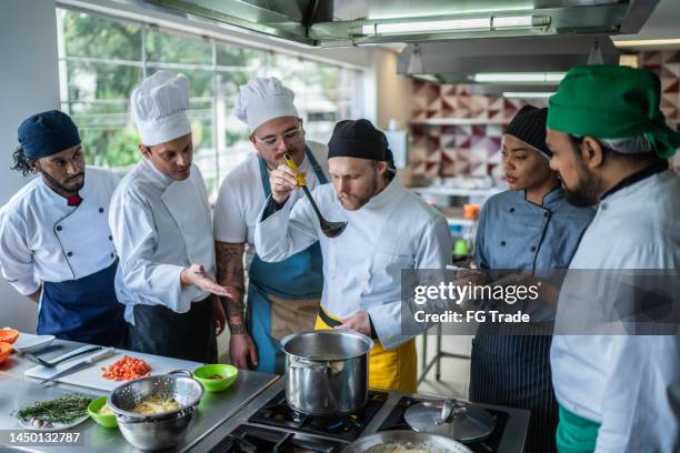 students preparing food during cooking class - course meal stock pictures, royalty-free photos & images