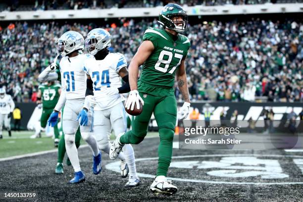 Uzomah of the New York Jets celebrates a touchdown during the second half against the Detroit Lions at MetLife Stadium on December 18, 2022 in East...