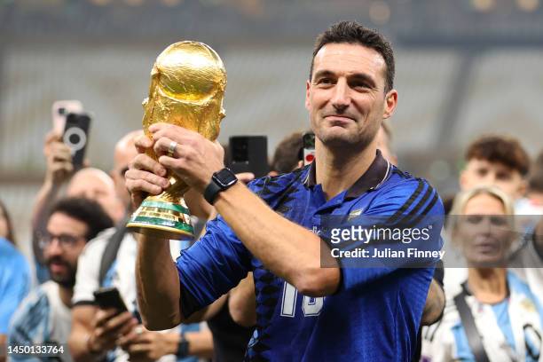 Lionel Scaloni, Head Coach of Argentina, celebrates with the FIFA World Cup Qatar 2022 Winner's Trophy after the FIFA World Cup Qatar 2022 Final...