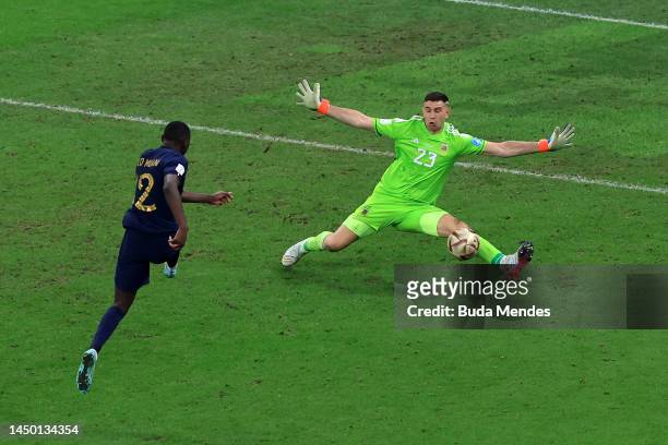 Randal Kolo Muani of France has a shot saved by Emiliano Martinez of Argentina during the FIFA World Cup Qatar 2022 Final match between Argentina and...