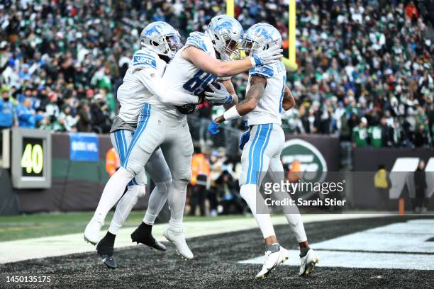 Brock Wright of the Detroit Lions celebrates a touchdown during the fourth quarter a at MetLife Stadium on December 18, 2022 in East Rutherford, New...