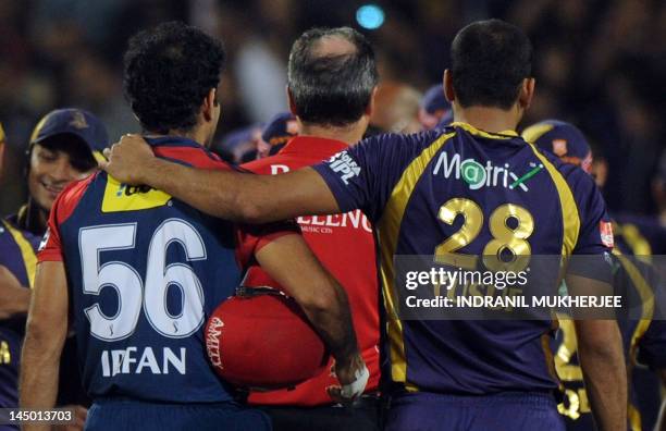 Delhi Daredevils cricketer Irfan Pathan is consoled by brother and Kolkata Knight Riders cricketer Yusuf Pathan after the IPL Twenty20 first playoff...