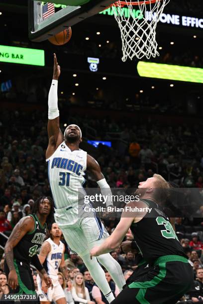 Terrence Ross of the Orlando Magic attempts a layup in front of Sam Hauser of the Boston Celtics during the second quarter at the TD Garden on...