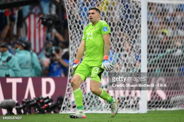 Emiliano Martinez of Argentina celebrates after saving the second penalty by Kingsley Coman of France during the FIFA World Cup Qatar 2022 Final...