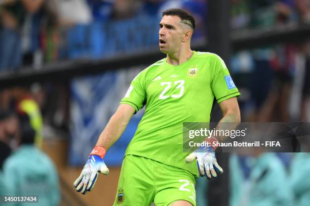 Emiliano Martinez of Argentina celebrates after saving the second penalty by Kingsley Coman of France during the FIFA World Cup Qatar 2022 Final...